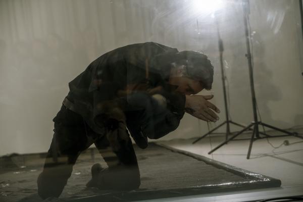 Detailed view of Robert J. Tomsons at the Black Sand Performance.